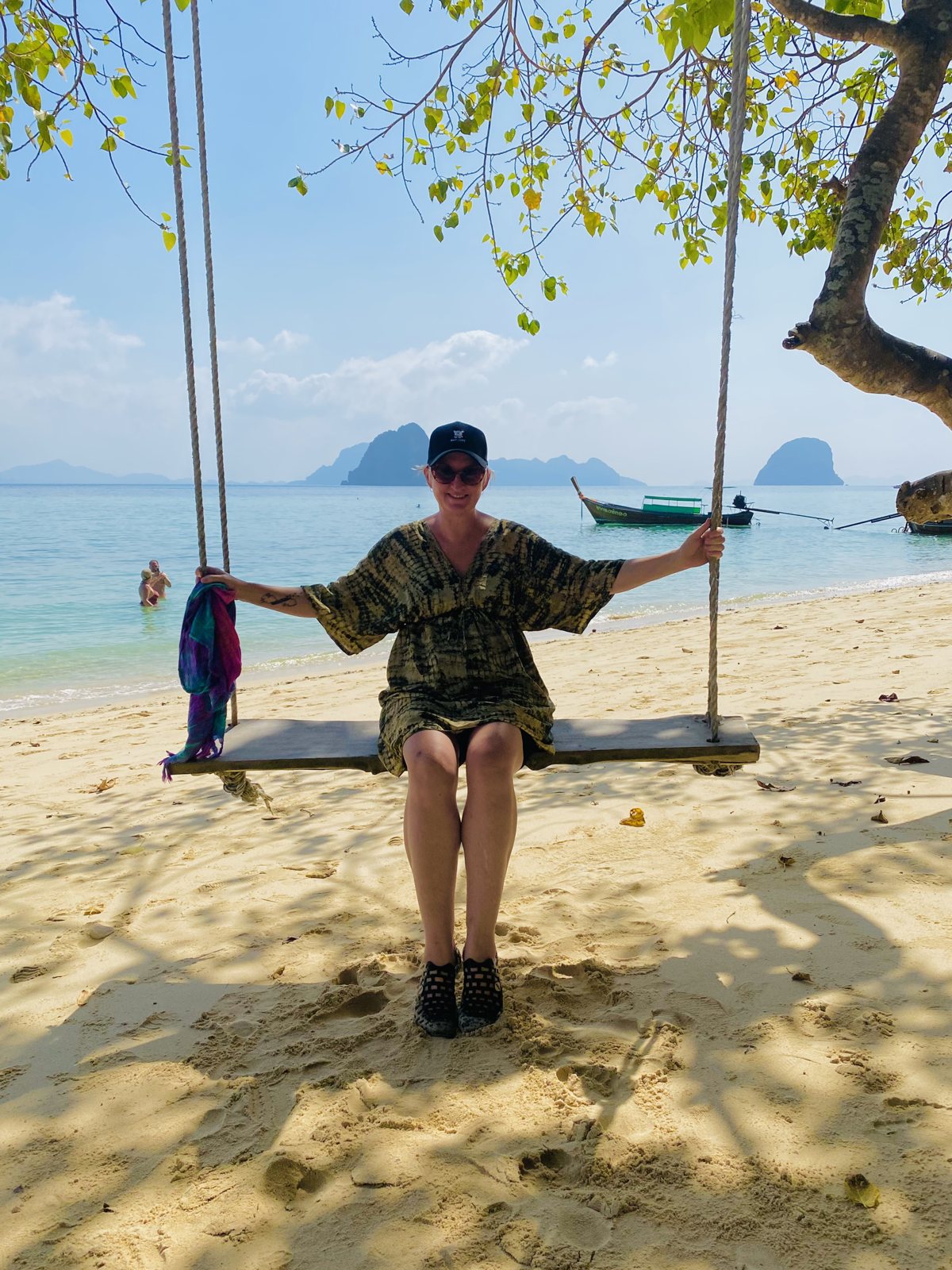 Lianne Byrne on a rope swing on a beach in Thailand