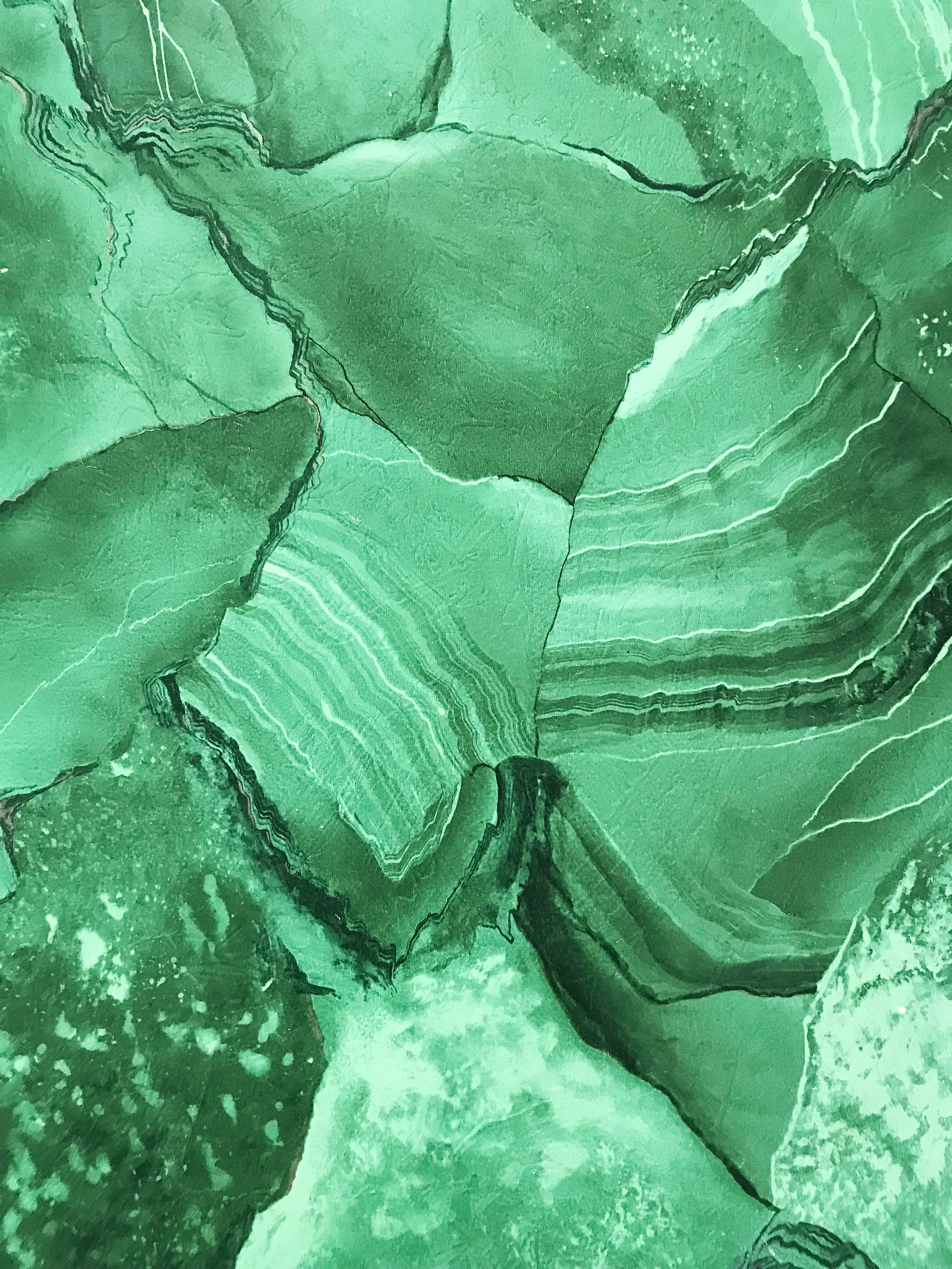 Malachite mineral — layered, complex, vivid green — a metaphor for the depth of midlife